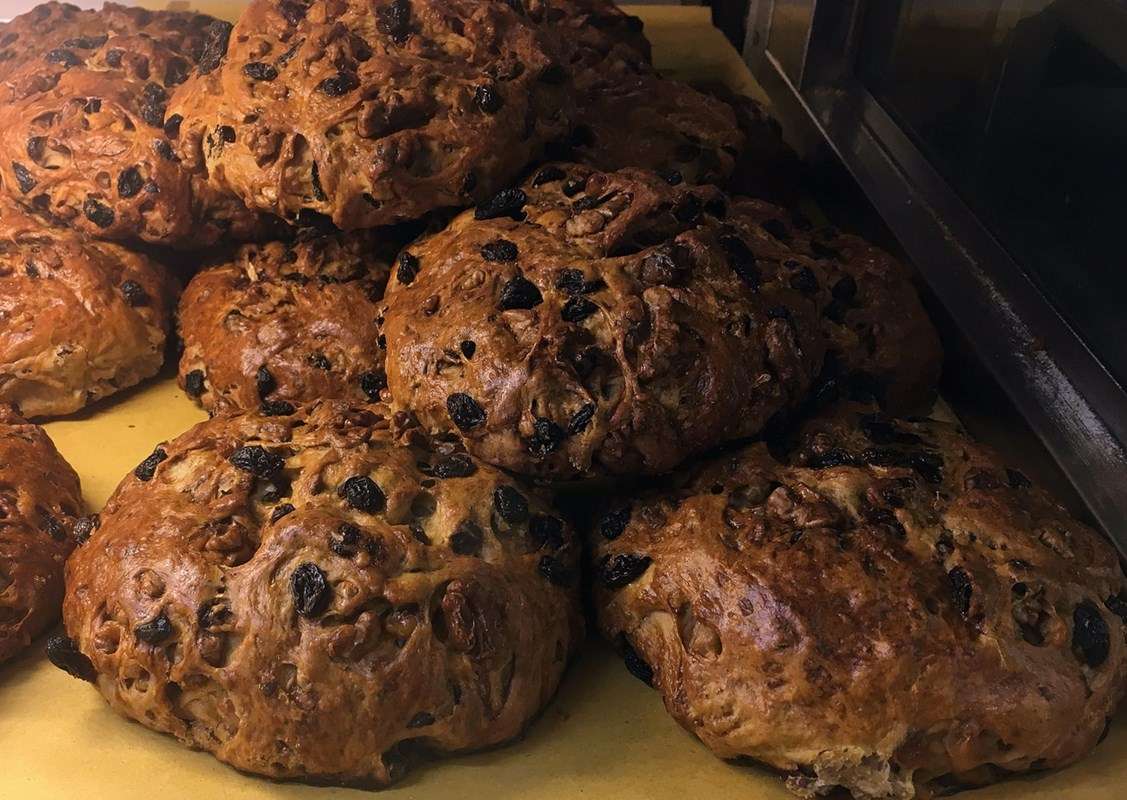 In the foreground, a typical Tuscan sweet bread prepared for All Souls' Day and All Saints' Day.