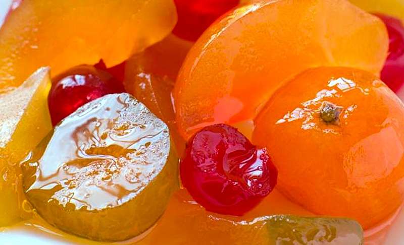 A close-up of fruit preserved in the form of mostarda, a typical side to Italian holiday dishes.
